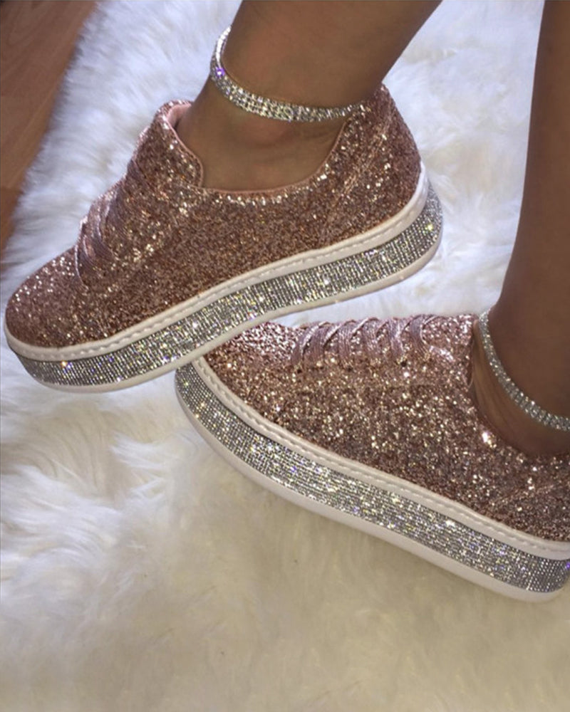 Fashion-forward women's glitter platform sneakers. Comfortable and stylish footwear for modern women.