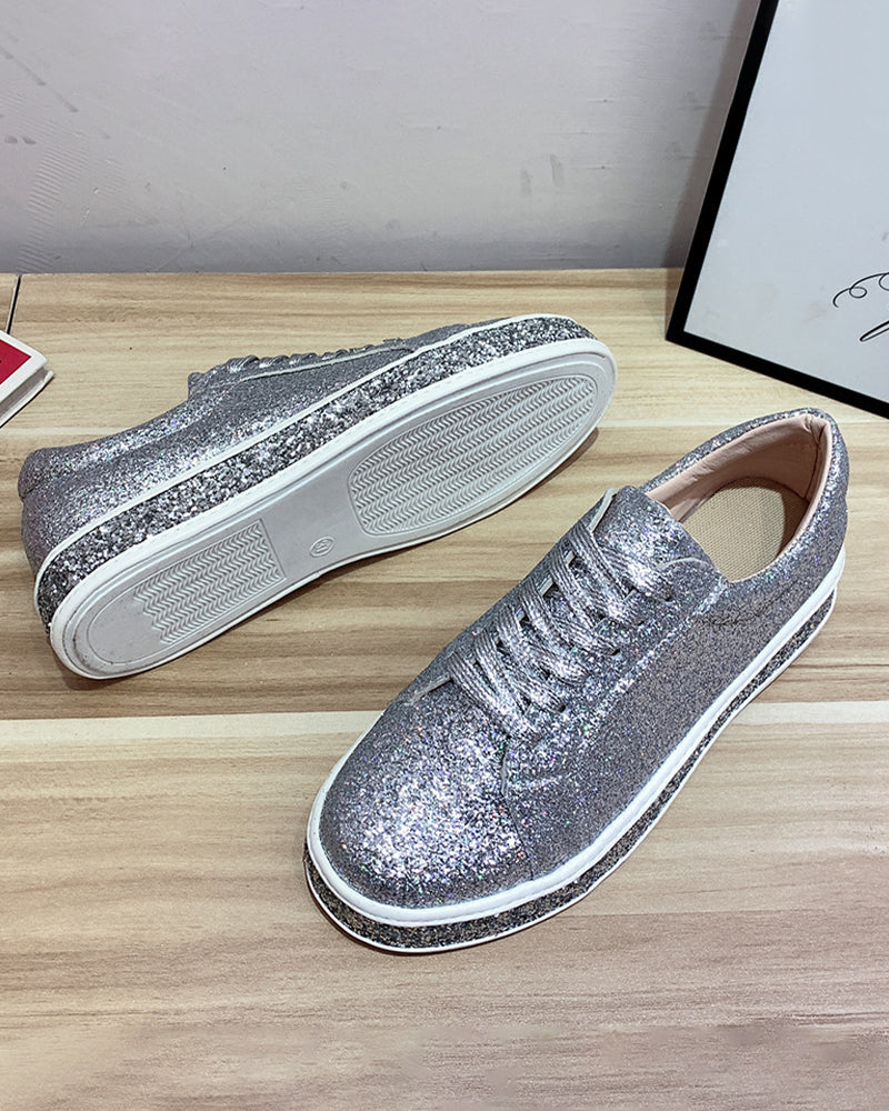 Side view of women's glitter platform sneakers, showcasing the elevated sole and sparkling design.