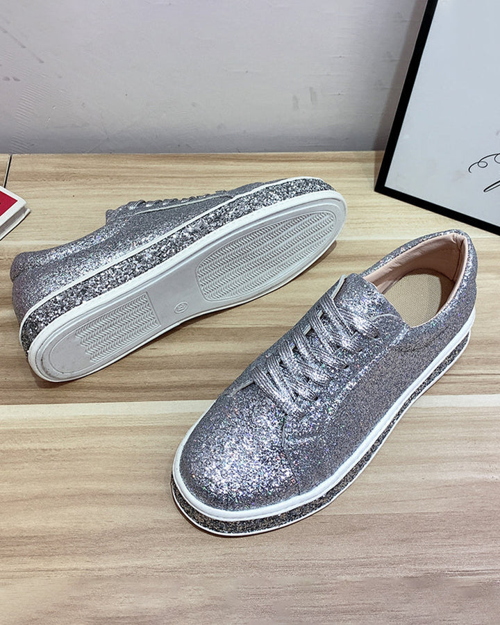 Side view of women's glitter platform sneakers, showcasing the elevated sole and sparkling design.