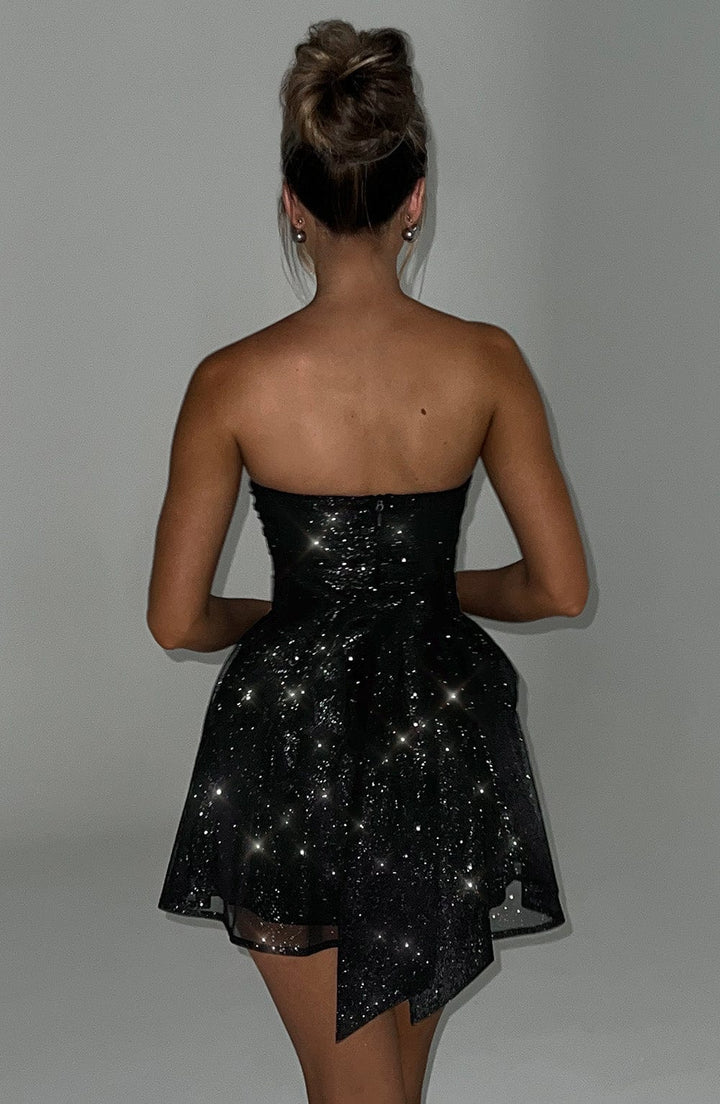 Shimmering glitter strapless mini skater dress for women, ideal for dancing at homecoming or parties.