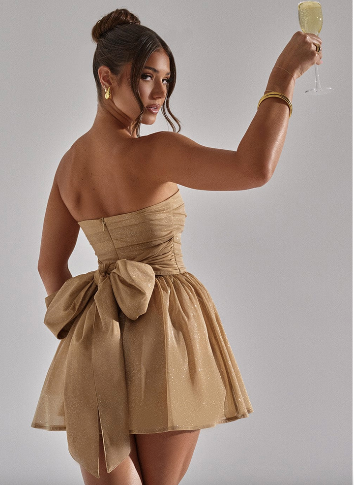 Dazzling gold glitter strapless skater mini dress, a chic choice for homecoming or formal events.
