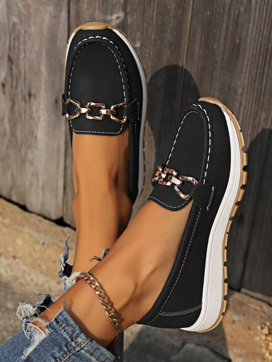 Contemporary women's flatform loafers with a gold chain trim. Round toe, slip-on for effortless casual style.