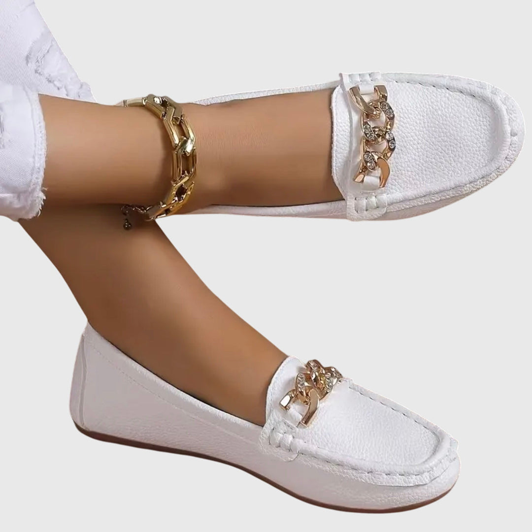 Women's gold-chain wedge loafers with sparkling crystal accents for elegant style.