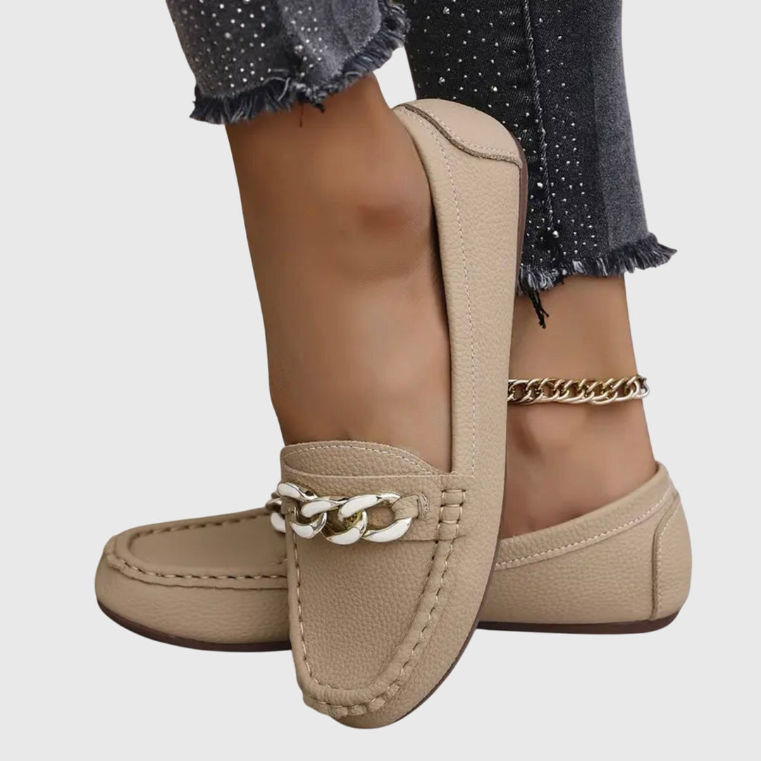 Chic wedge loafers for women, combining comfort and style with gold chain & crystal embellishment.
