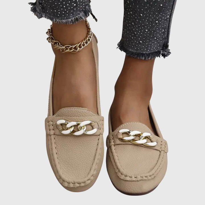 Stylish women's elegant wedge loafers, adorned with a gold chain & dazzling crystals.