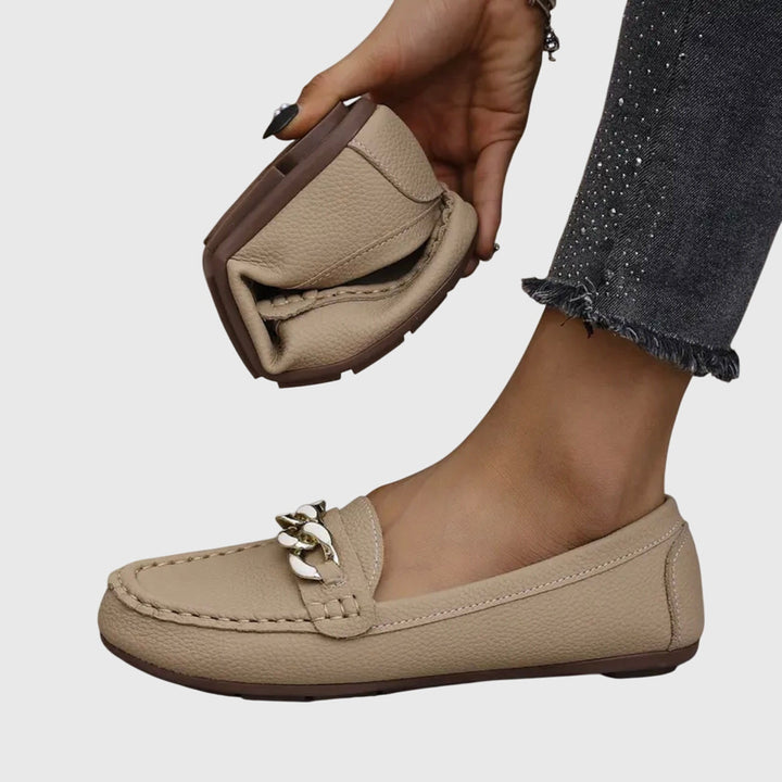 Comfortable women's slip-on wedge loafers, featuring a fashionable gold chain & crystal design.
