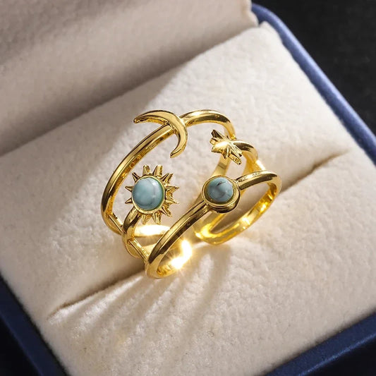 Women's gold finish celestial sun & star ring with vibrant turquoise. Perfect adjustable statement jewelry.