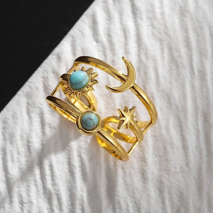 Adjustable stainless steel celestial sun & star ring for women, featuring a striking turquoise stone.