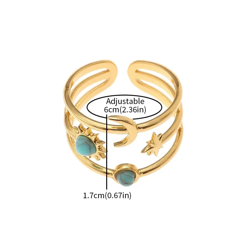 Stunning women's celestial gold finish ring with sun, star, and turquoise. Adjustable & fashionable statement piece.