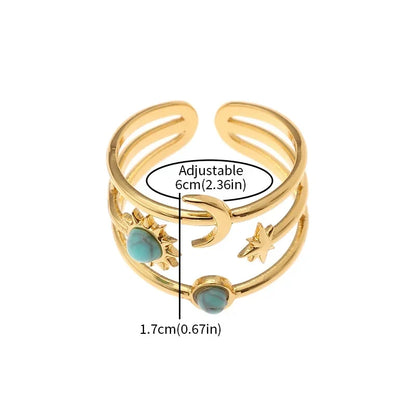 Stunning women's celestial gold finish ring with sun, star, and turquoise. Adjustable & fashionable statement piece.
