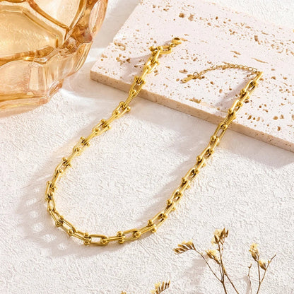 Versatile gold link chain necklace & bracelet for women, layered for style. Gold-plated stainless steel jewelry.