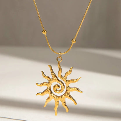 Elegant women's sun charm necklace in gold-plated stainless steel, a chic bohemian jewelry accessory.