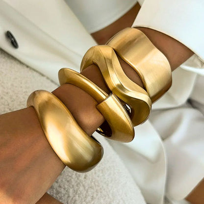 Women's Gold Tone Wave Cuff Bracelets, 4-piece stackable set. Elegant vintage-style fashion jewelry.
