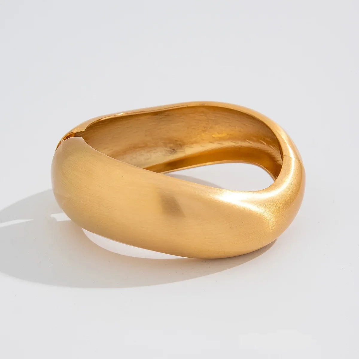 Distinctive wave design gold tone cuff bracelets for women. Stackable 4-piece set, a chic vintage fashion accessory.