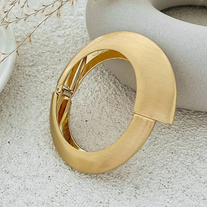Luxurious gold tone wave cuff bracelets for women. This 4-piece stackable set offers a vintage-style elegant look.