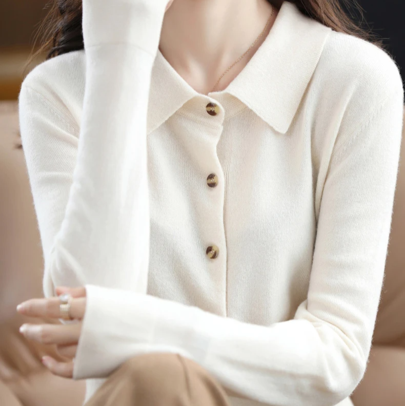 Women's collared Grace button-up top with tortoiseshell details. Versatile long sleeve shirt for modern apparel.