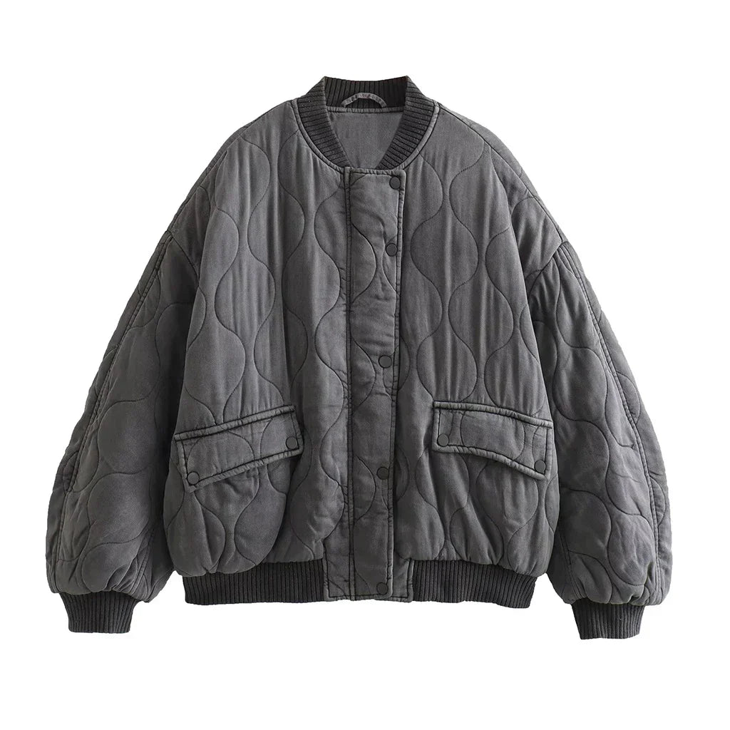 Women's gray quilted bomber jacket, cozy for everyday wear. Chic fall & winter outerwear.