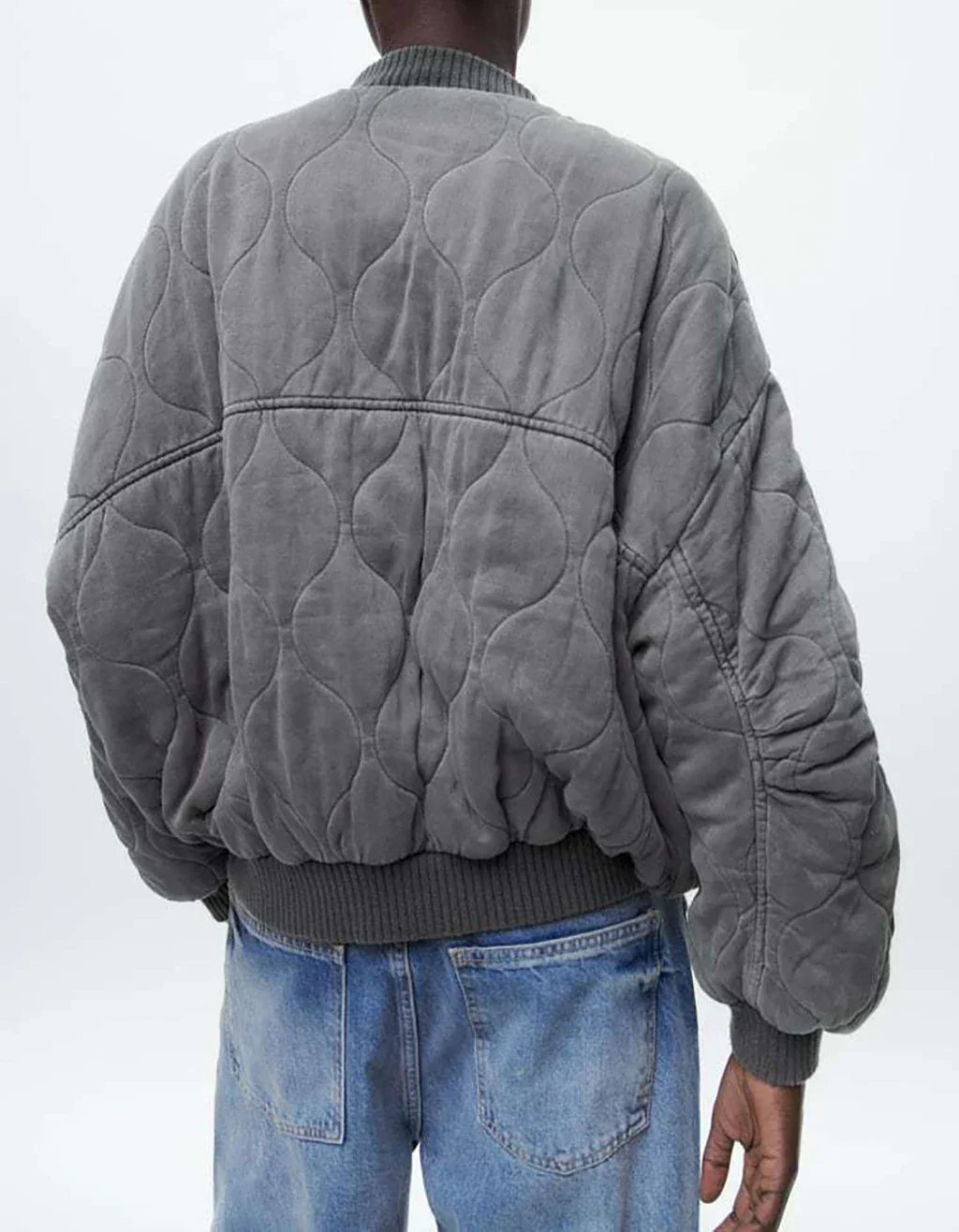 Stylish gray quilted bomber jacket for women. Modern, casual outerwear perfect for fall & winter fashion.