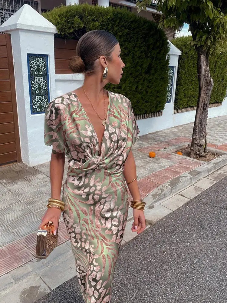 Versatile women's green printed wrap midi dress. Relaxed fit design suitable for parties, vacations, and events.