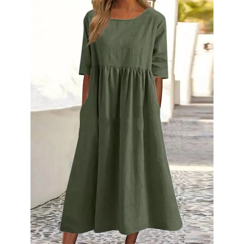 Women's half-sleeve maxi dress with convenient side pockets, perfect for casual summer style & comfort.