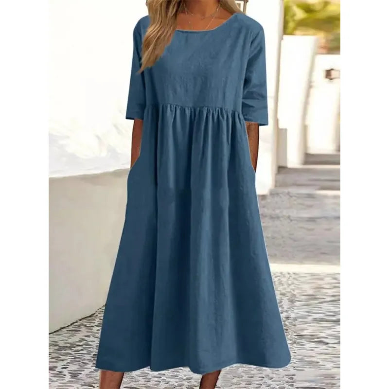 Comfortable women's maxi dress with functional pockets & half sleeves. A versatile long dress for summer fashion.