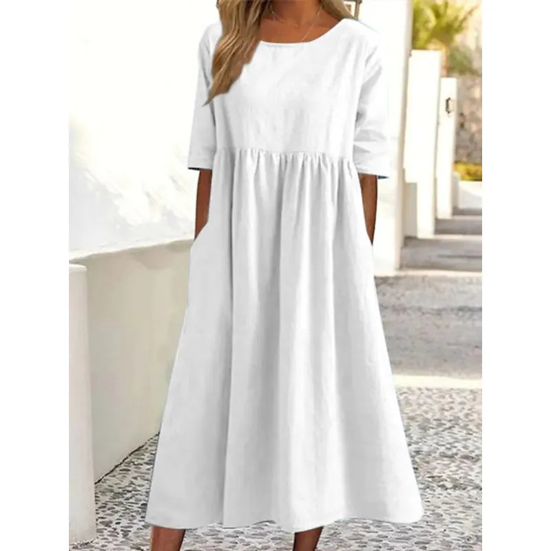 Flowing women's long maxi dress with half sleeves & pockets. An elegant and versatile casual dress for summer.