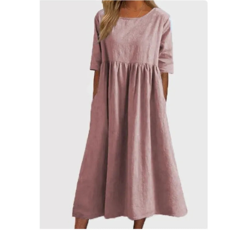 Well-fitting women's half-sleeve maxi dress with deep pockets. A comfortable long dress for elegant everyday style.