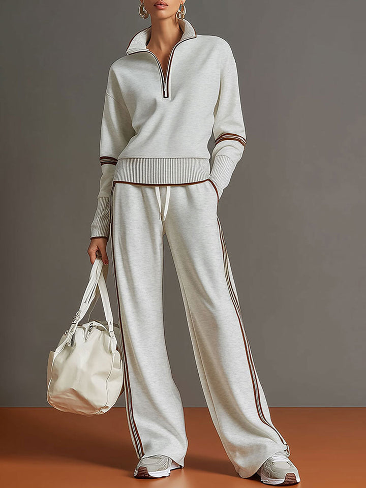 Women's half-zip sweatshirt & wide-leg trouser co-ord set. Stylish, comfortable loungewear.