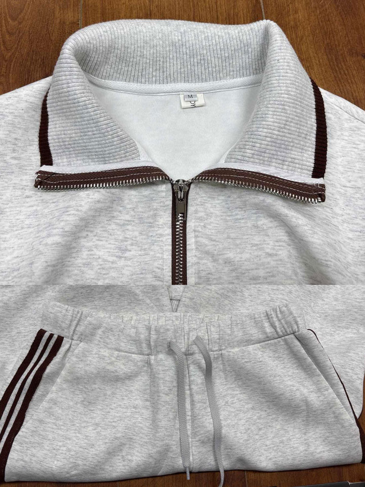 Chic women's athleisure set. Half-zip sweatshirt and flowy wide-leg trousers. Effortless style.