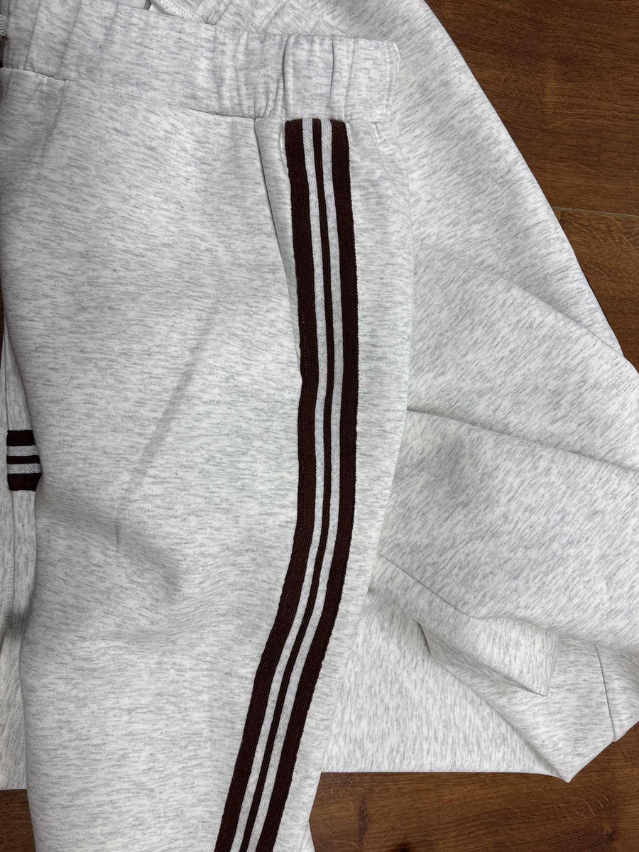 Women's matching half-zip top and wide-leg pants. Casual, comfortable, and modern co-ord.