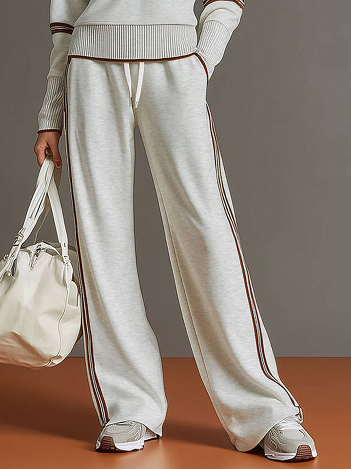 Relaxed women's two-piece set. Half-zip top and wide-leg trousers for ultimate comfort & style.