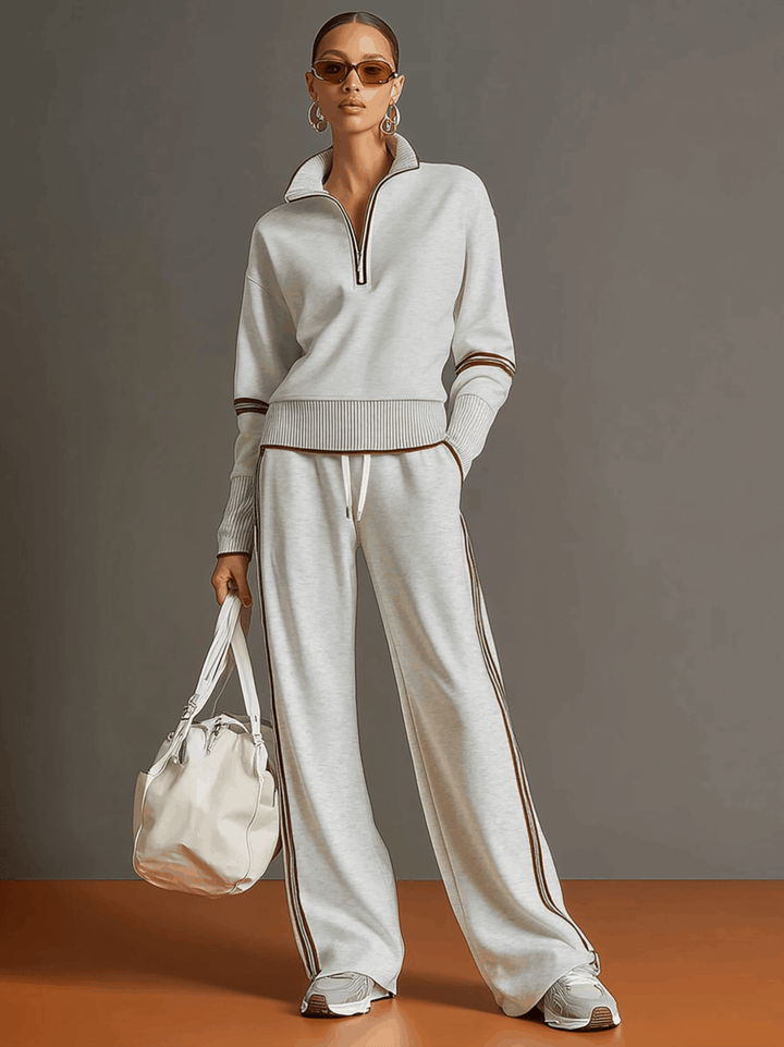 Casual women's two-piece matching set with half-zip top & flowy wide-leg pants.