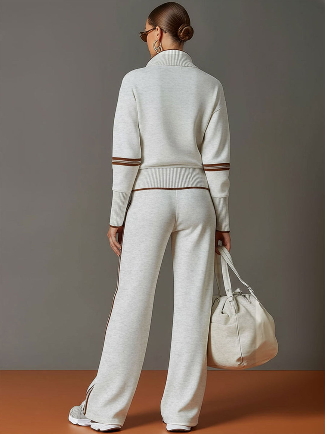 Stylish women's co-ord featuring a half-zip sweatshirt and chic wide-leg trousers.