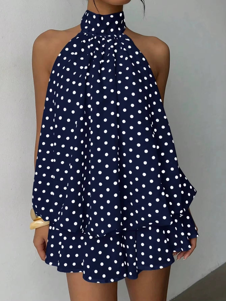 Feminine women's party mini dress: halter neckline, delicate ruffle hem, and a chic open back.
