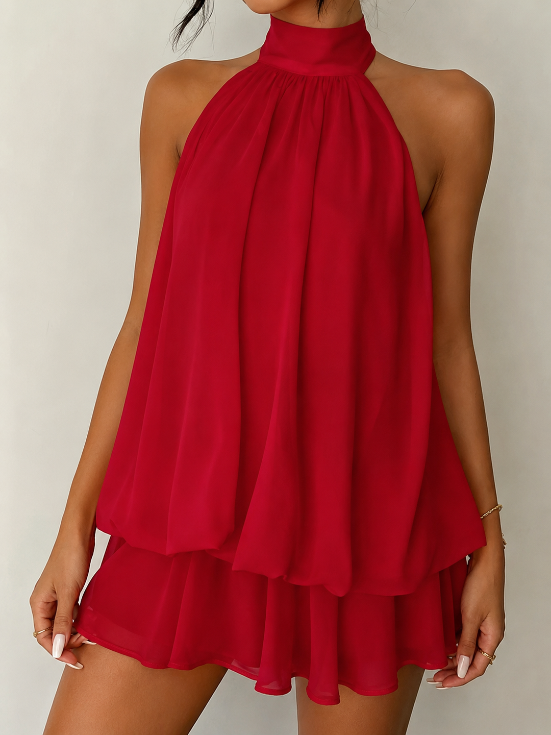 Women's stunning halter mini dress designed with a beautiful ruffle hem and attractive open back.