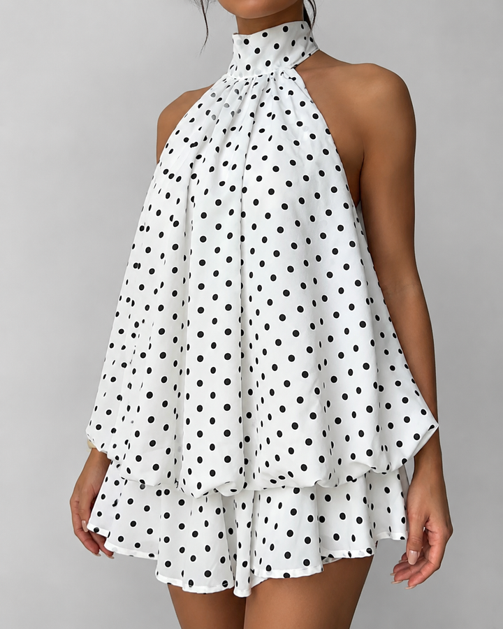 Chic women's sleeveless halter mini dress, ideal for summer parties and events with its ruffle hem.