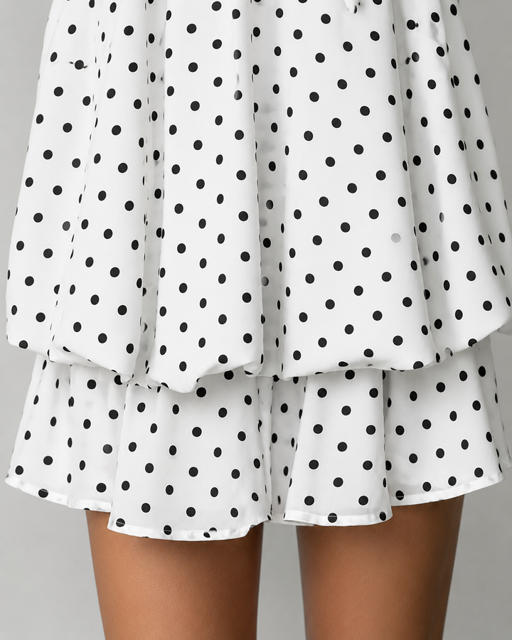 Stylish trapeze style halter mini dress for women, boasting a trendy ruffle hem and open back detail.