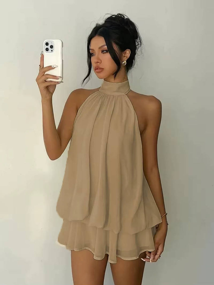 Summer event women's mini dress: halter neck, ruffle hem, and sexy open back for a glamorous look.