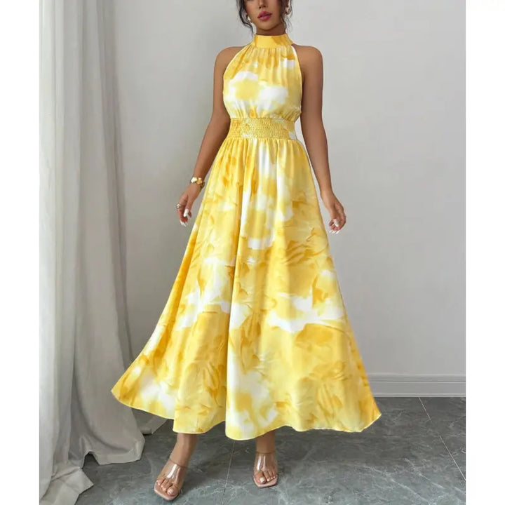 Elegant women's halter neck maxi dress. Flowy abstract print fabric & flattering smocked waist. Summer fashion.