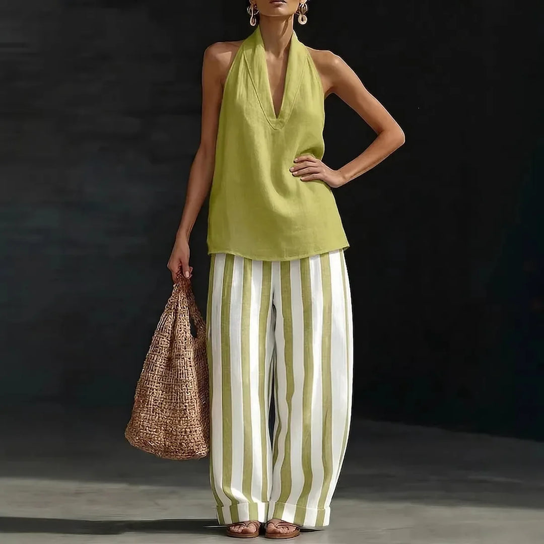 Chic two-piece set: women's halter neck top & high-waist wide leg pants. Perfect resort wear or casual style.