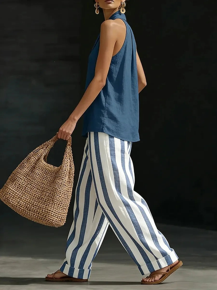 Boho chic women's matching set: comfortable halter top and flowy wide leg pants for summer fashion.