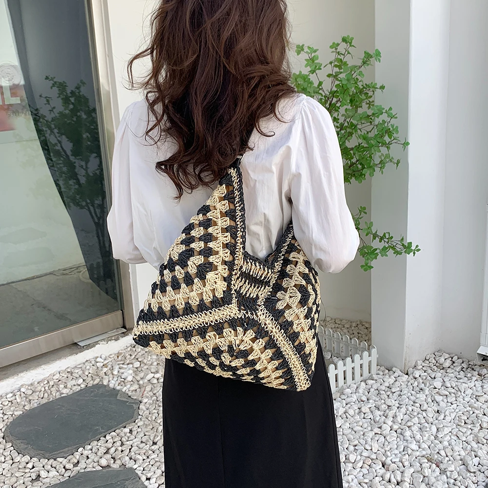 Casual women's hand-crocheted boho tote bag, perfect for beach or summer style.