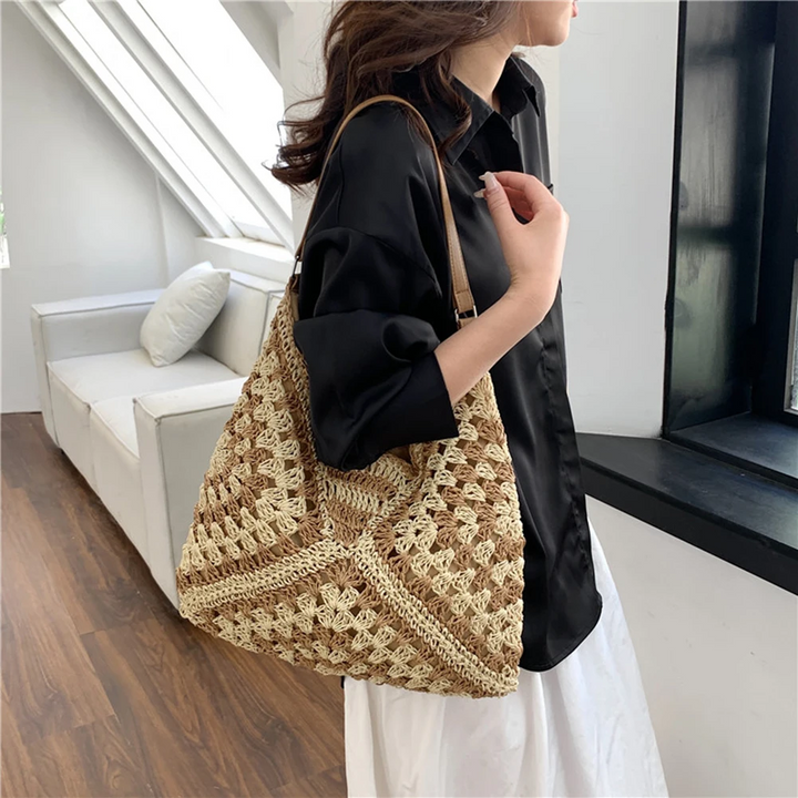 Travel-friendly lightweight women's hand-crocheted boho tote, a summer essential.