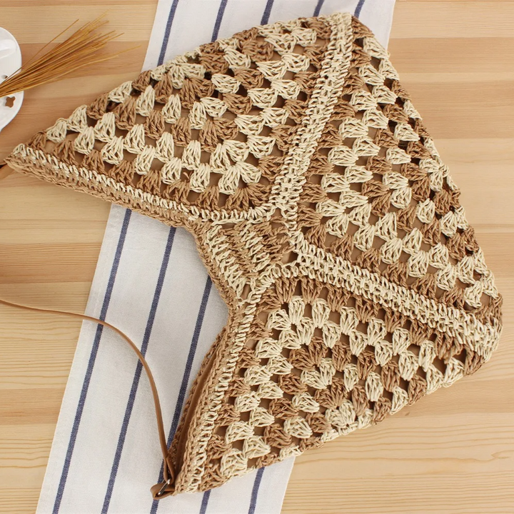 Fashionable women's hand-crocheted boho tote bag, a unique and stylish summer accessory.