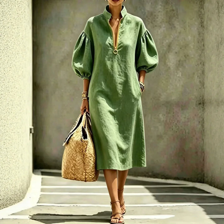 Comfortable Haven Beck women's midi dress. Chic design with bubble sleeves & half-zip, offering versatile modern style.