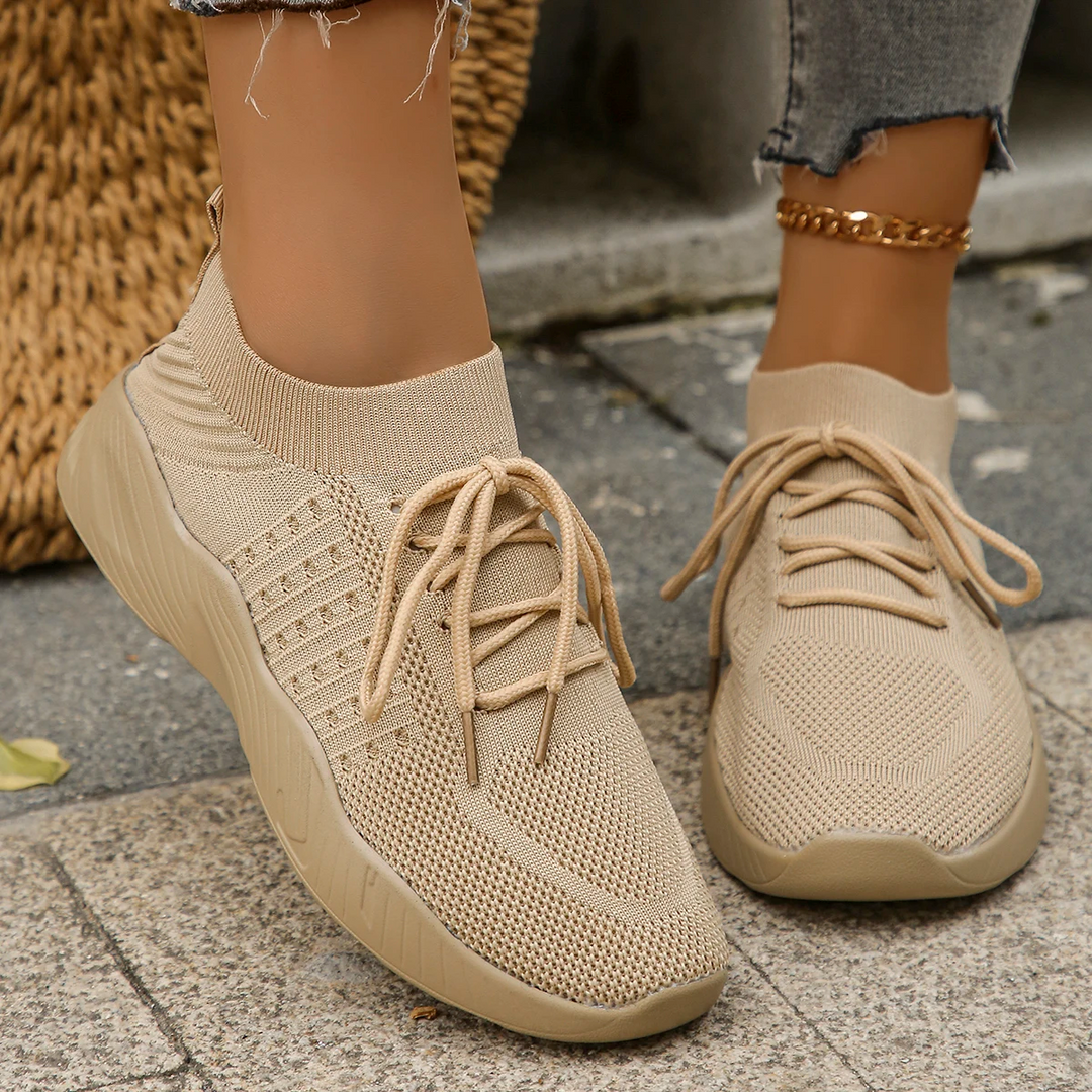 Modern women's slip-on sneakers, lightweight & breathable design for casual footwear.