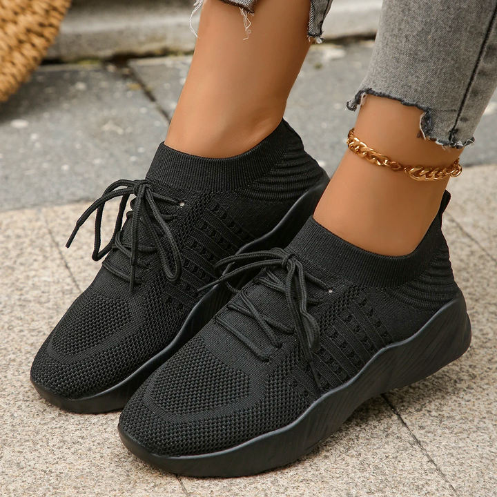 Breathable women's athletic sneakers, lightweight stretch for active comfort and support.