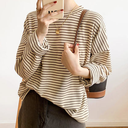 Relaxed fit women's heritage stripe crewneck long sleeve top. Versatile for layering & casual fashion.