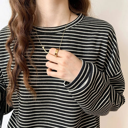 Versatile women's relaxed top with heritage stripes. Long sleeve, crewneck, ideal for casual layering.