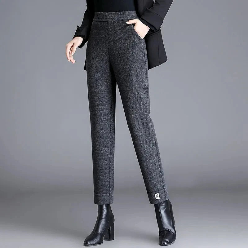 Chic women's herringbone tailored trousers, a high-waist design offering a sophisticated look for workwear.